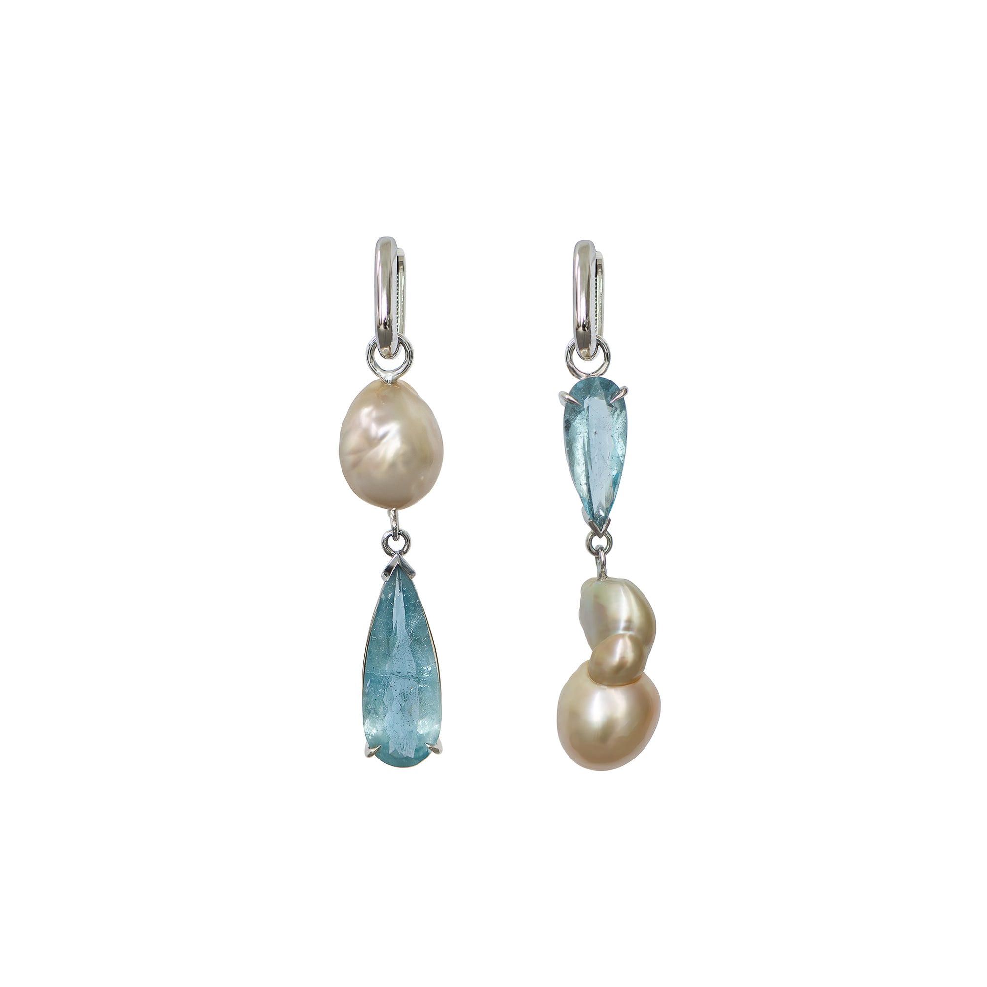 White gold huggie earrings with aquamarines and golden South Sea pearls, displayed on a white background.