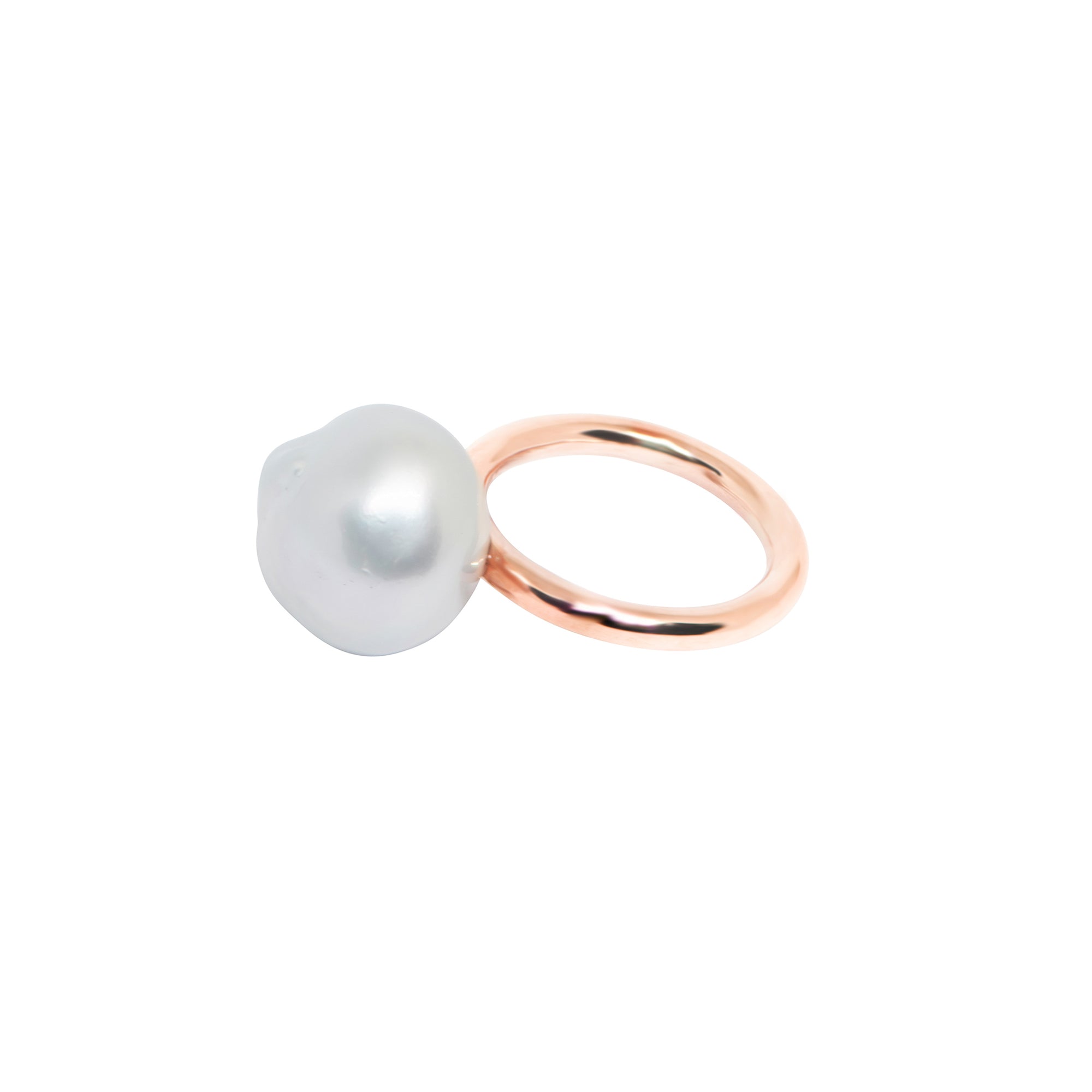 Hand selected unique baroque South Sea pearl with natural white colour that includes overtones of pink and silver, set on a rose gold ring with high polish finish, displayed on a white background.