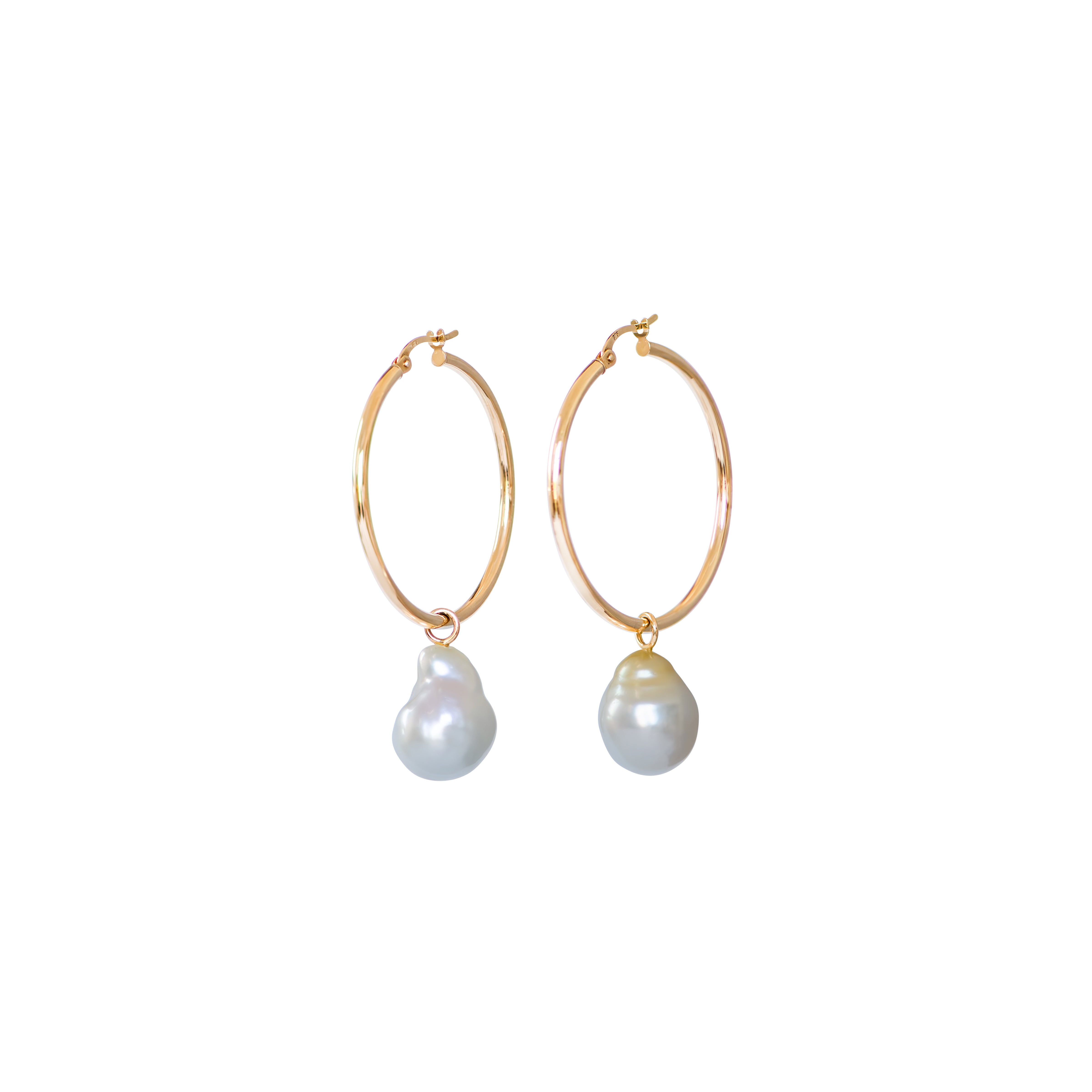 Hand selected unique baroque white and golden South Sea pearls, in a hand crafted yellow gold detachable setting, on medium yellow gold high polish hoop earrings, displayed on a white background.