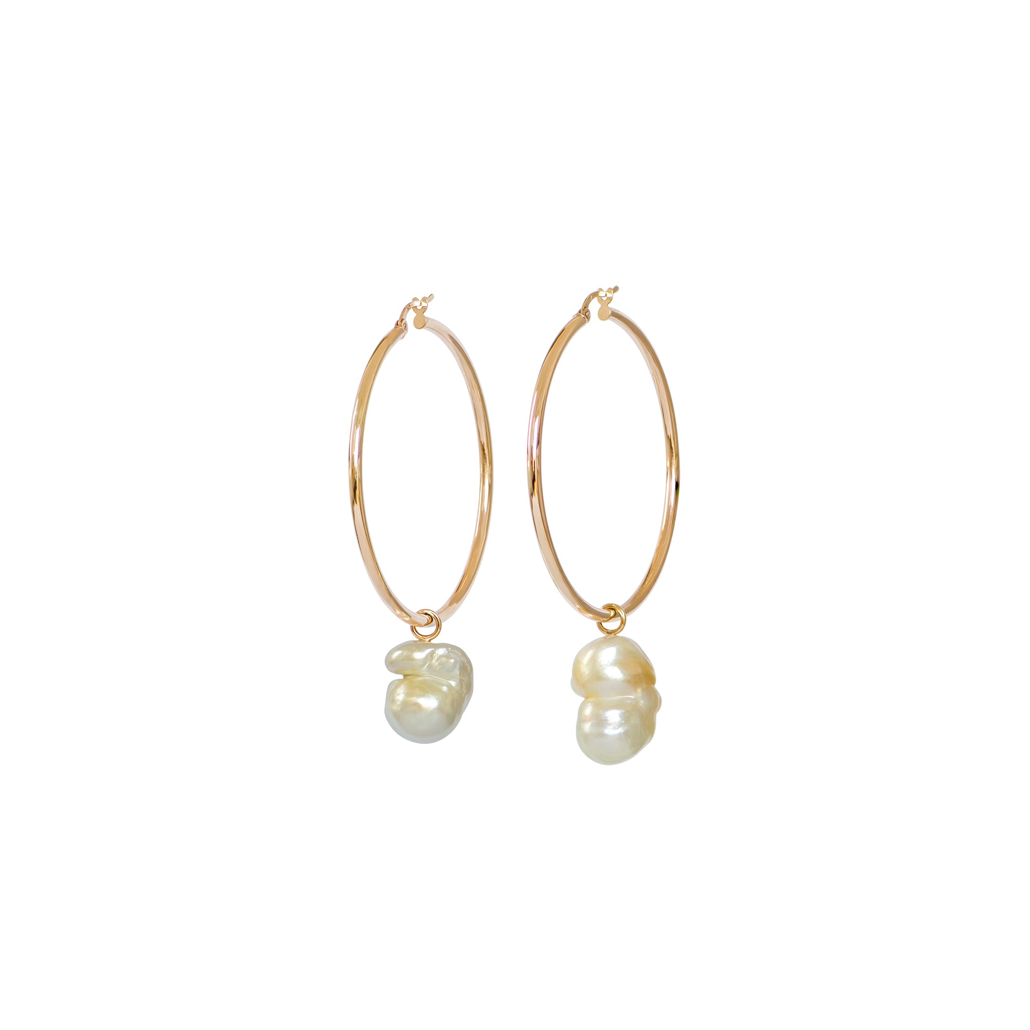 Hand selected unique baroque golden South Sea pearls, in a hand crafted yellow gold detachable setting, on large yellow gold high polish hoop earrings, displayed on a white background.